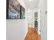 Inviting hallway with hardwood floors, stylish artwork, and access to various rooms within the home at 642 Bridlewood Ln, Mount Pleasant, SC 29464