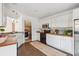 Well-appointed kitchen featuring tile backsplash, wood countertops, stainless appliances, and access to laundry area at 642 Bridlewood Ln, Mount Pleasant, SC 29464