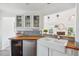 Updated kitchen showcasing a farmhouse sink, stainless steel appliances, and natural light from an adjacent living area at 642 Bridlewood Ln, Mount Pleasant, SC 29464