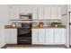 Functional kitchen featuring white cabinets, stainless steel appliances, butcher block countertops, and ample counter space at 642 Bridlewood Ln, Mount Pleasant, SC 29464