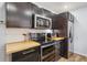 The kitchen is equipped with stainless steel appliances, dark cabinets, and butcher block countertops at 642 Bridlewood Ln, Mount Pleasant, SC 29464