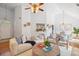 Open-concept living room featuring a bar, fireplace, and a dining area at 642 Bridlewood Ln, Mount Pleasant, SC 29464