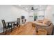 Open-concept living space with hardwood floors, comfortable seating, and a cozy dining area at 642 Bridlewood Ln, Mount Pleasant, SC 29464