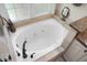 Top-down view of bathroom tub with jacuzzi jets, and tiled border at 652 Spinner Cir, Mount Pleasant, SC 29464
