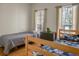 Bedroom features two twin beds, natural light and hardwood floors at 652 Spinner Cir, Mount Pleasant, SC 29464
