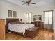 Spacious bedroom features hardwood floors, tray ceiling, and wooden furniture for a cozy retreat at 652 Spinner Cir, Mount Pleasant, SC 29464