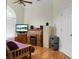 Bedroom showcasing a daybed, desk, and ample storage, enhanced by natural light and hardwood floors at 652 Spinner Cir, Mount Pleasant, SC 29464