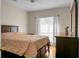 Bedroom with hardwood floors, ceiling fan, curtains and view at 652 Spinner Cir, Mount Pleasant, SC 29464