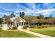 Charming clubhouse featuring a classic design, surrounded by lush landscaping and inviting walkways at 652 Spinner Cir, Mount Pleasant, SC 29464