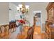 Dining area featuring a hardwood dining table set, wooden hutch and view into the living room at 652 Spinner Cir, Mount Pleasant, SC 29464