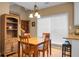 Dining area featuring wooden table, chairs, built-in bookcase, and natural light from a window at 652 Spinner Cir, Mount Pleasant, SC 29464
