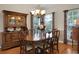Dining room with hardwood flooring, chandelier, and a wooden china cabinet at 652 Spinner Cir, Mount Pleasant, SC 29464