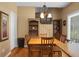 Cozy dining area featuring hardwood floors, a wooden table set, and an elegant chandelier at 652 Spinner Cir, Mount Pleasant, SC 29464