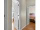 Hallway with multiple entryways and hardwood flooring creating a seamless transition between rooms at 652 Spinner Cir, Mount Pleasant, SC 29464