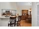 Kitchen bar looking into the dining area, featuring granite counters and barstool seating at 652 Spinner Cir, Mount Pleasant, SC 29464