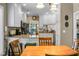 Bright kitchen with white cabinets, granite countertops, wooden chairs and stainless steel appliances at 652 Spinner Cir, Mount Pleasant, SC 29464