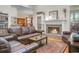 Bright living room with hardwood floors, fireplace, and comfortable seating arrangements for relaxation and conversation at 652 Spinner Cir, Mount Pleasant, SC 29464