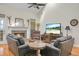 Bright living room boasts hardwood floors, vaulted ceiling, fireplace, and comfortable seating arrangements at 652 Spinner Cir, Mount Pleasant, SC 29464
