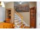 A bright staircase with wooden stairs and white railings, leading to the upper level of the home at 652 Spinner Cir, Mount Pleasant, SC 29464