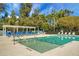 Well-appointed swimming pool with multiple access points and seating areas, ideal for relaxation and social gatherings at 652 Spinner Cir, Mount Pleasant, SC 29464