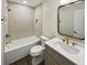 Stylish bathroom features modern vanity, sleek subway tile shower, and updated fixtures at 702 Spark St, Mount Pleasant, SC 29464