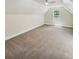 Lofted bedroom space with neutral carpet, a window, and vaulted ceiling at 702 Spark St, Mount Pleasant, SC 29464