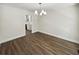 A well lit, open-concept dining room features hardwood floors and modern finishes at 702 Spark St, Mount Pleasant, SC 29464