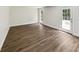 Room boasting hardwood floors, white walls, a window, and glass panel door to the outside at 702 Spark St, Mount Pleasant, SC 29464