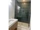 Modern bathroom with a glass-enclosed shower, stone accents, and a stylish vanity at 758 Mccants Dr, Mount Pleasant, SC 29464