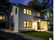 Charming two-story home with a well-manicured lawn and inviting front porch at dusk at 758 Mccants Dr, Mount Pleasant, SC 29464