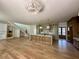 Spacious open-concept kitchen featuring a large island, modern lighting, and unfinished cabinetry at 758 Mccants Dr, Mount Pleasant, SC 29464