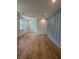 Bright and spacious bedroom with wood floors, board and batten accent wall, and large windows at 758 Mccants Dr, Mount Pleasant, SC 29464