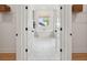 Bright bathroom featuring a modern soaking tub, white tile floors, and plenty of natural light at 766 Maynard Ln, Summerville, SC 29486