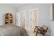 A bedroom featuring light gray walls, modern furnishings and convenient access to a well-appointed bathroom at 766 Maynard Ln, Summerville, SC 29486
