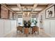 Stunning dining area boasting wood-beamed ceilings and a modern chandelier over a stylish dining table at 766 Maynard Ln, Summerville, SC 29486