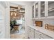 A glimpse of a dining room with wooden beams, viewed from a well lit kitchen with quartz countertop at 766 Maynard Ln, Summerville, SC 29486