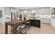 Eat-in kitchen with a large island, white cabinets, stainless steel appliances, and modern lighting at 766 Maynard Ln, Summerville, SC 29486
