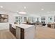Spacious open-concept kitchen with a large island, modern appliances, and a view to the living room at 766 Maynard Ln, Summerville, SC 29486