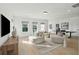 Spacious living room with plenty of light, wood floors and comfortable furniture at 766 Maynard Ln, Summerville, SC 29486