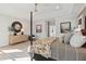 Comfortable main bedroom featuring hardwood floors, decorative furnishings, and a doorway to the en-suite bathroom at 766 Maynard Ln, Summerville, SC 29486
