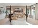 Spacious primary bedroom with a four-poster bed, hardwood floors, and large windows offering plenty of natural light at 766 Maynard Ln, Summerville, SC 29486
