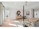 Bright main bedroom with hardwood floors, a four-poster bed, and a sunny ambiance from the surrounding windows at 766 Maynard Ln, Summerville, SC 29486