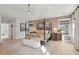 Spacious main bedroom with hardwood floors, a four-poster bed, and ample natural light from surrounding windows at 766 Maynard Ln, Summerville, SC 29486