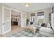 Bright sunroom that has seamless access to the kitchen, offering comfortable seating and natural light at 766 Maynard Ln, Summerville, SC 29486