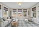 Cozy sunroom with multiple windows, comfortable seating, and a relaxing atmosphere at 766 Maynard Ln, Summerville, SC 29486