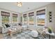 Inviting sunroom featuring large windows offering natural light, plus comfortable seating for relaxing at 766 Maynard Ln, Summerville, SC 29486