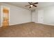 Spacious bedroom with ceiling fan and ensuite bathroom entrance at 8285 Little Sydneys Way, North Charleston, SC 29406