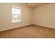 Cozy bedroom with a window and carpeted floor, offering a tranquil atmosphere at 8285 Little Sydneys Way, North Charleston, SC 29406
