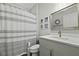 Bathroom featuring decorative mirror, striped shower curtain, commode and white countertops at 8400 Camp Gregg Ln, North Charleston, SC 29418