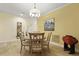 Bright dining room with wood floors, a modern chandelier, and a large window at 8400 Camp Gregg Ln, North Charleston, SC 29418